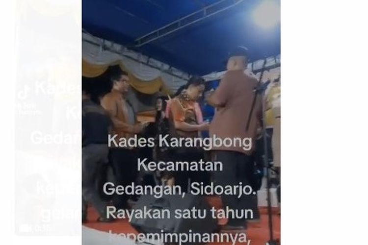 Tangkapan layar dari video yang menunjukkan kepala desa di Sidoarjo gelar pertunjukan dan sawer biduan untuk peringatan satu tahun menjabat