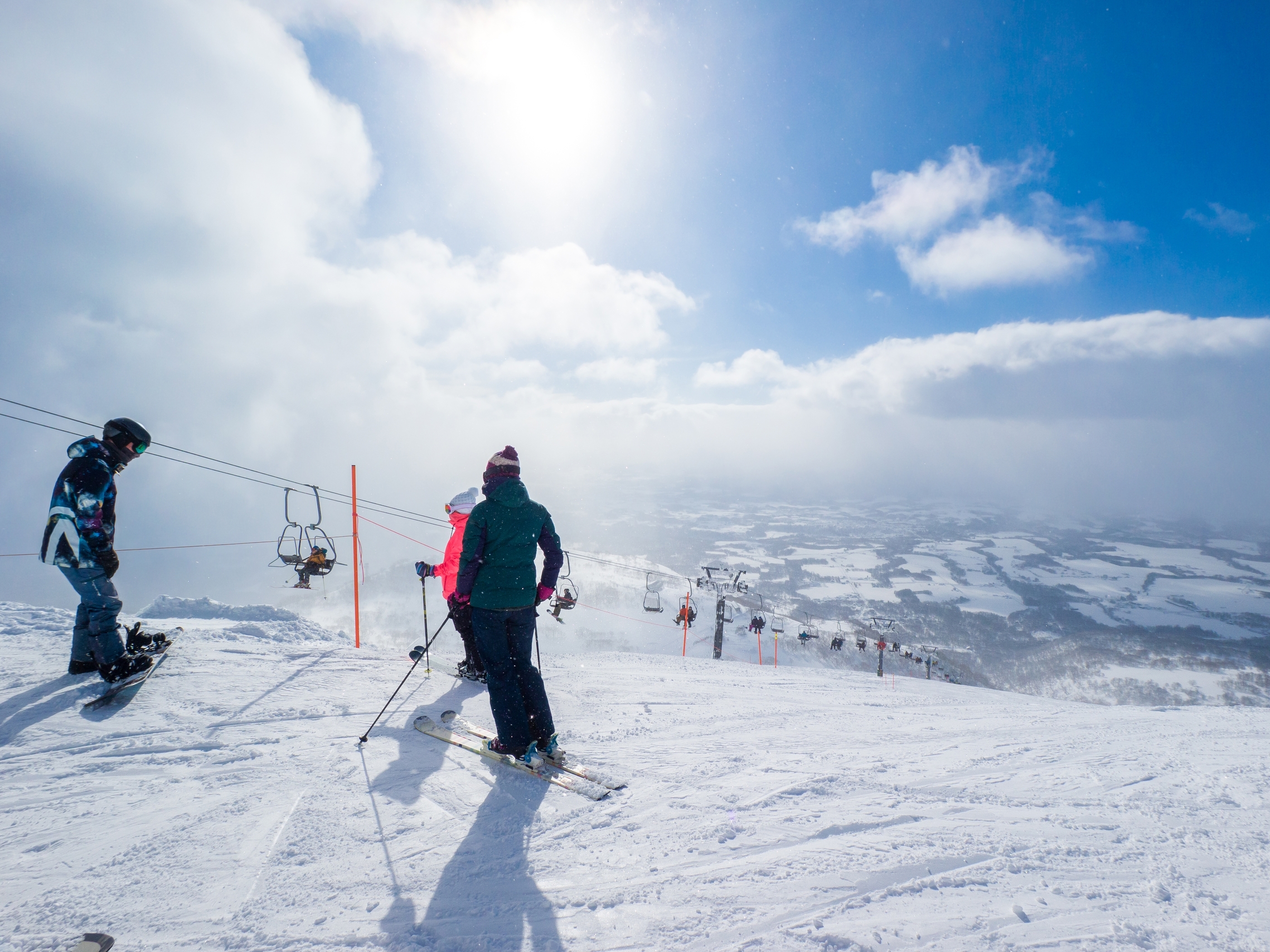 Overlooking a town from high up on a ski slopes.