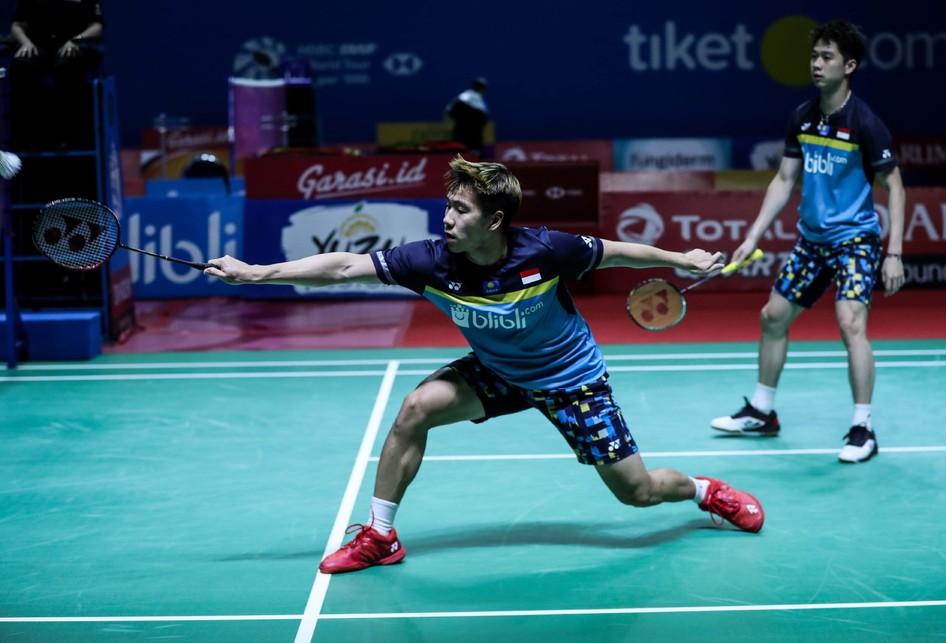 Pasangan ganda putra Indonesia, Marcus Gideon/Kevin Sanjaya, saat melawan ganda putra Tiongkok, Ou Xuan Yi/Zhang Nan dalam perempatfinal Indonesia Open 2019 di Istora Senayan, Jakarta, Jumat (19/7/2019).